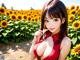 A woman in a red dress standing in a field of sunflowers.